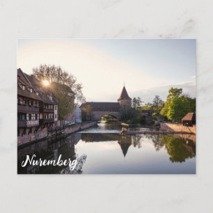 Solnedgång över gammal medeltida bro i Nürnberg Vykort