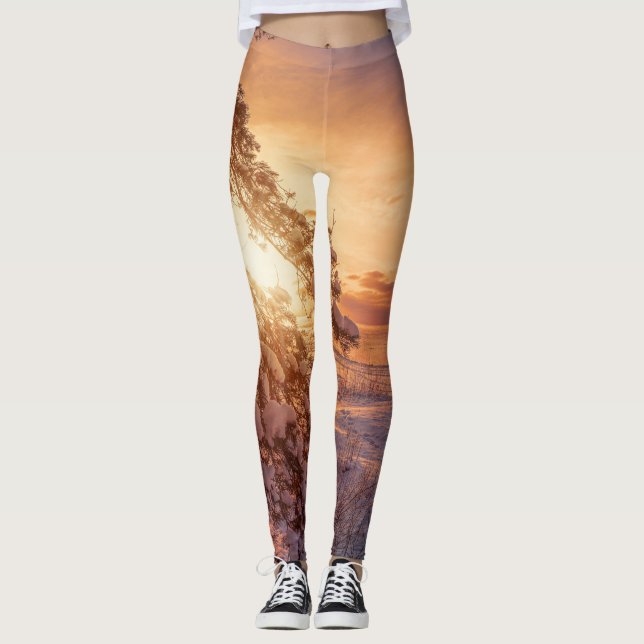 Solnedgång över havs och snö gräs träd leggings (Framsida)