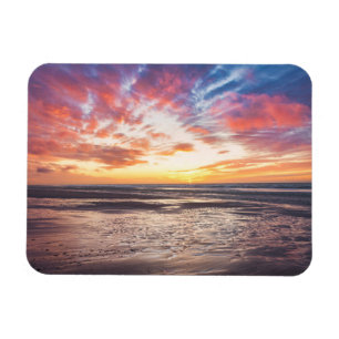 Solnedgång över strand och hav magnet