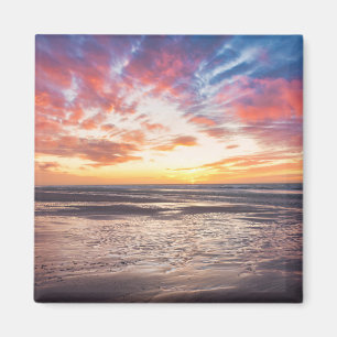 Solnedgång över strand och hav magnet
