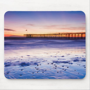 Solnedgång över Ventura Pier och strand Musmatta