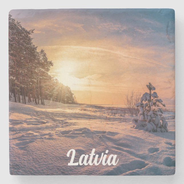 Solnedgång över vinterhavet kusten stenunderlägg (Framsidan)