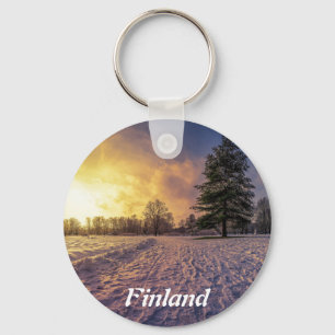 Solnedgång över vinterparken nyckelring