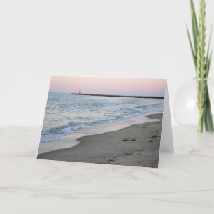 Solnedgång på stranden kort