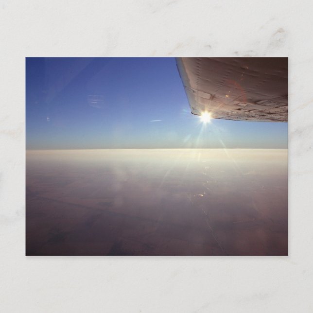 Solnedgång under vingen vykort (Framsida)