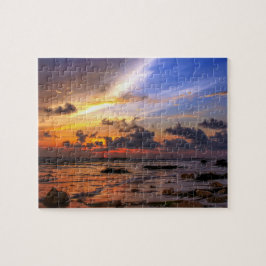 Solnedgång vid stranden pussel