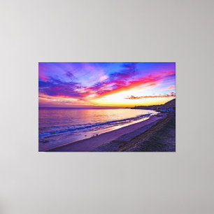 solnedgång vid strandinslagen canvas