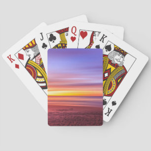Solnedgångshimmel över strand och hav casinokort