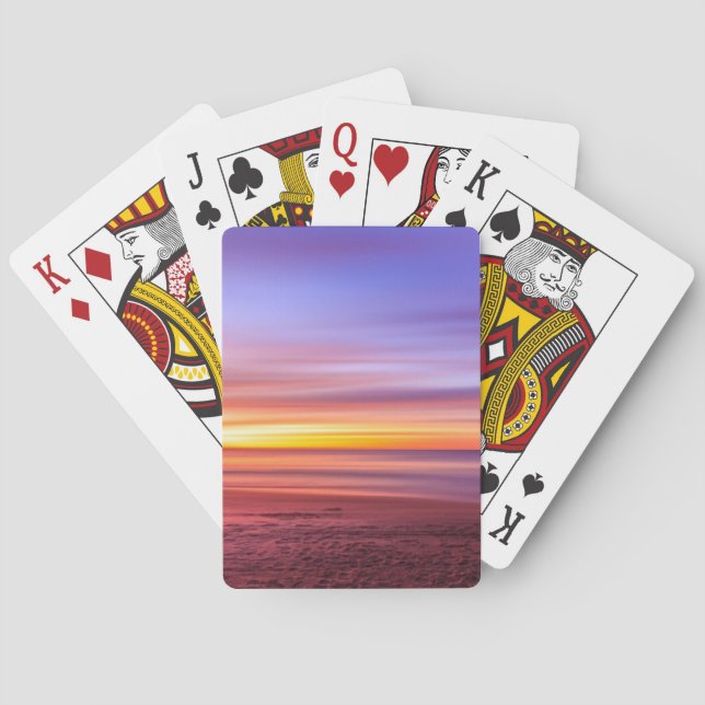 Solnedgångshimmel över strand och hav casinokort (Baksidan)