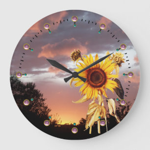 SOLROS OCH SOMMARSOLNEDGÅNG MED ROSA MOLN STOR KLOCKA