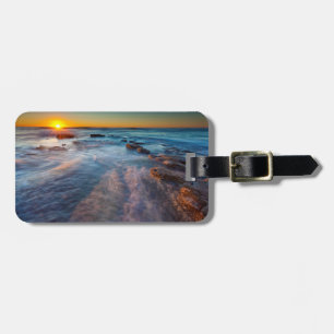 Solstrålar belyser Stilla havet Bagagebricka