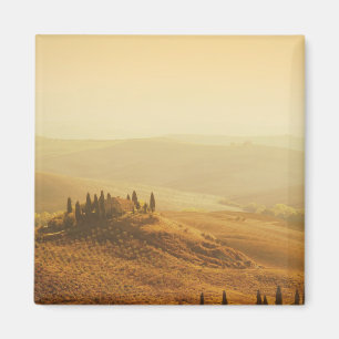 Soluppgång över en landskap i den Tuscany magnet