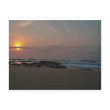 Soluppgång över en raketbassäng vid havet