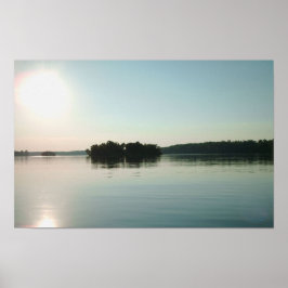 Soluppgång över lugn sjö poster