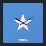 Somalia Flag Dazzling Patriotic Fyrkantig Klocka<br><div class="desc">Somalia Flag Dazzling Patriotic Square Wall Clock in the colors and the elements of the Somalia national flag covering the front of the clock. National flag colors are complemented with the text "Somalia" on the bottom. Text is fully customizable using "Customize it!" feature. Feel free to change it, remove it...</div>