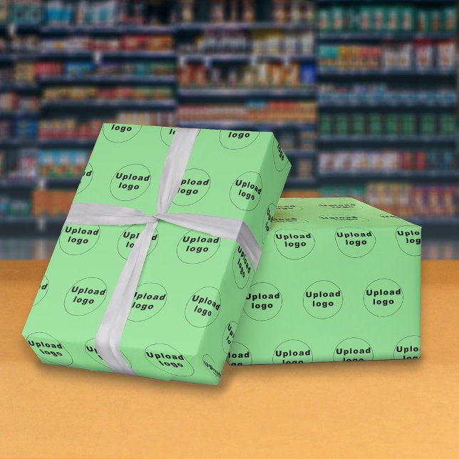 Sömlös Logotyp Ljust grönt Wrapping Papper Presentpapper (Seamless pattern of your business logo on light green wrapping paper.)