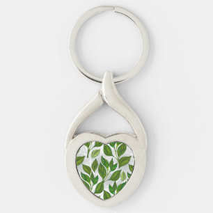 Sömlös Mönster med Grönt Tea Löv Twisted Heart Silverfärgad Nyckelring