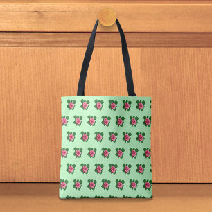 Sömlöst mönster med rosa ros på ljusgrön totebag tygkasse