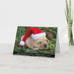 Sömnig Labrador Retriever-valpen med Santa Hat Helgkort