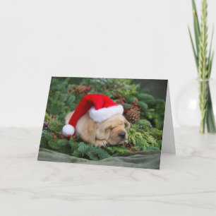 Sömnig Labrador Retriever-valpen med Santa Hat Helgkort
