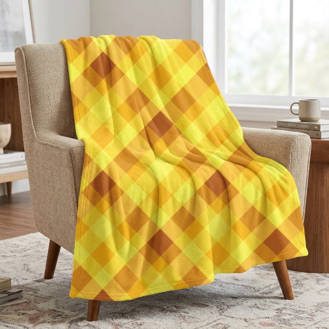 Söt äggula karotröja i mediumstorlek filt (Cute Egg Yolk Yellow Plaid Medium Fleece Blanket draped over a chair in a living room.)