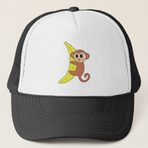 Söt baby-apa på banan keps