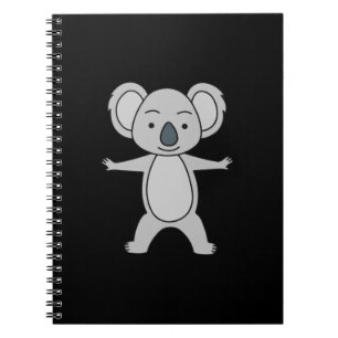 Söt babykoala med ett leende som står upp anteckningsbok