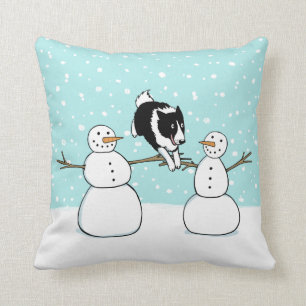 Söt Border Collie-valp på vinterlov med snömannen Kudde
