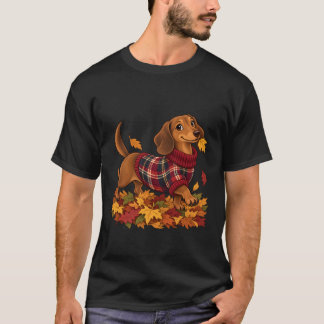 Söt dachshund som bär randig höstsjalett i löv t shirt