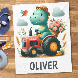 Söt dinosaurie på röd traktor fleecefilt