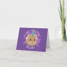 Söt födelsedags-hamster som tittar genom hål