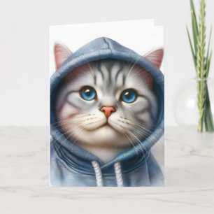 Söt grå och vit tabbymask med blå ögon i hoodie kort
