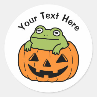 Söt groda i halloweenpumpa runt klistermärke
