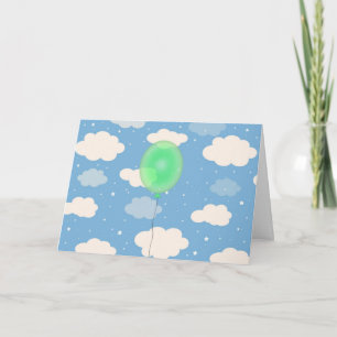 Söt grön ballong och en glad födelsedagshimmel kort