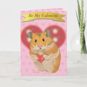 Söt guldhamster som håller ett hjärta helgkort