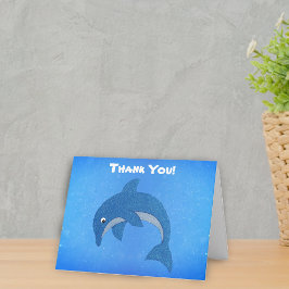 Söt hoppande glitter som tecknad blå delfin tack kort