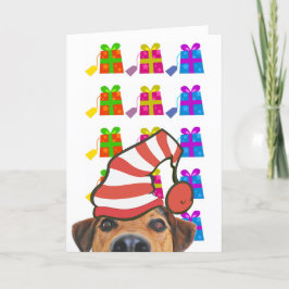 Söt hund med julhatt och presenter semesterkort helgkort