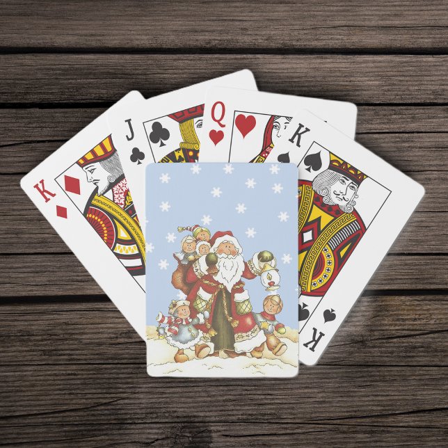 Söt jul tomte folkkonst barn jul snöflingor spelkort (Santa Claus with lantern and little children in falling snow on deck of playing cards.)