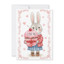 Söt kanin som håller rosa cupcake