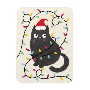 Söt katt med tomtehatt och julbelysning magnet