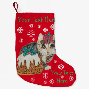 Söt kitten grått tabby slickande tass christmas liten julstrumpa