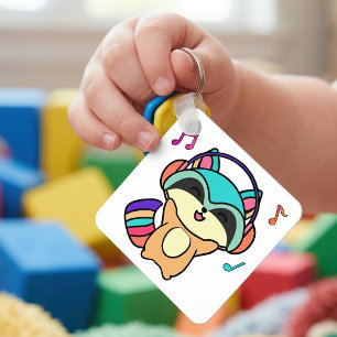 Söt leende Kawaii-babyvask med hörlurar Nyckelring