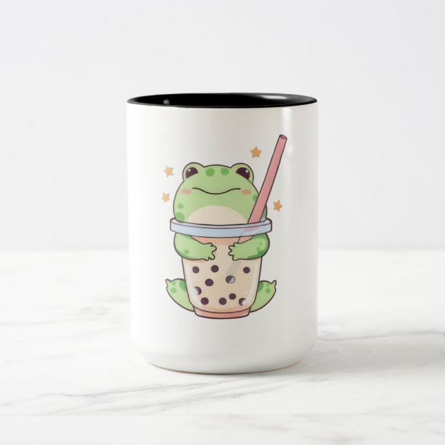 Söt liten groda som kramar om bubbelteacupen Två-Tonad mugg (Center)