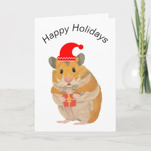 Söt liten julhamster som håller en present kort