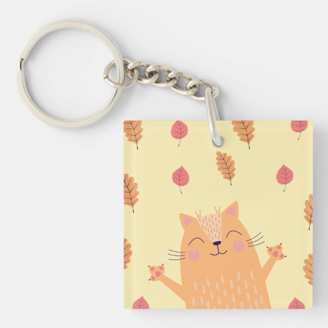 Söt orange katt leker i höstlöv (Framsidan)