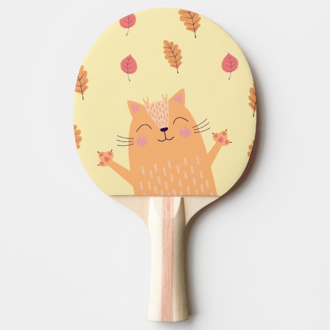 Söt orange katt leker i höstlöv pingisracket (Framsidan)