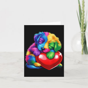 Söt regnbågsvalp som kramar Valentines hjärta barn Kort
