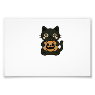 Söt svart katt som håller Jack O Lantern-pumpa � K Fototryck