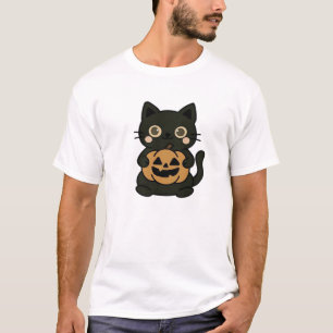 Söt svart katt som håller Jack O Lantern-pumpa � K T Shirt