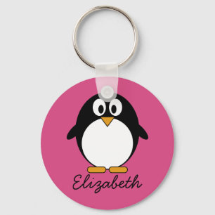 Söt tecknad penguin med rosa bakgrund nyckelring